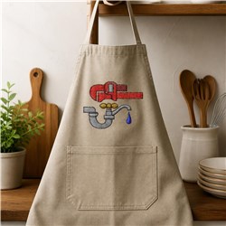 Playful beige apron featuring a red faucet, gray pipe, and blue water droplet embroidery, perfect for home cooks.