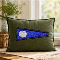 Decorative pillow with a rich green fabric, featuring a blue triangular patch and white circle in a modern, minimalistic styl