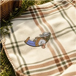 Playful embroidery of a man relaxing in a hammock with a plaid blanket and basket, evoking summer vibes.
