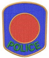 Police patch featuring a blue shield background, bold red circle, and green 'POLICE' text. Ideal for uniforms.