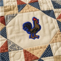 Colorful rooster at quilt center, detailed with browns, blues, and reds, surrounded by earthy geometric patterns.