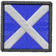 Scottish flag patch with a blue background, white diagonal cross, and black border, featuring a bold and simple design.