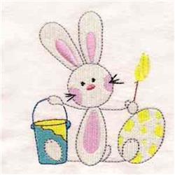Playful bunny with pink accents painting a colorful egg next to a blue bucket, perfect for Easter.