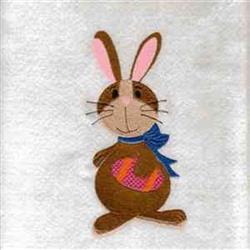 Playful bunny rabbit with pink ears and blue scarf holding a colorful Easter egg, celebrating the holiday.