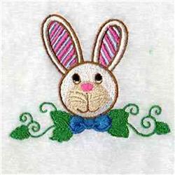 Cute bunny rabbit with striped ears and a pink nose, adorned with a blue bow, perfect for festive quilting.
