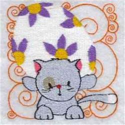 Playful gray cat with raised paws beside a colorful egg adorned with purple flowers, perfect for Easter quilting.
