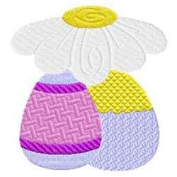 Playful white flower atop intricately designed Easter eggs in pastel pink and yellow, perfect for cheerful spring decor.