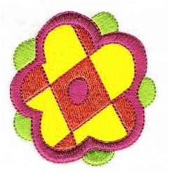 Applique flower design in vibrant yellow and red with pink outline, surrounded by green leaves.