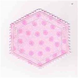 Hexagonal fabric patch in soft pink with lighter pink polka dots and zigzag edges, playful and whimsical design.