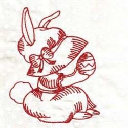 Redwork bunny with a hat and bow holding a decorated Easter egg, whimsical and festive for springtime crafts.