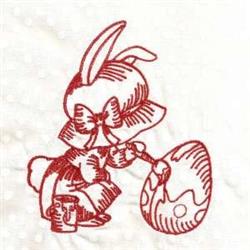 Redwork bunny joyfully painting a polka-dotted Easter egg with a painted can, wearing a festive bow.