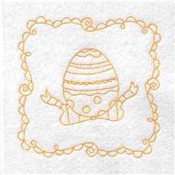 Redwork Easter egg with intricate patterns and swirling outlines, in golden thread on white fabric, perfect for spring.