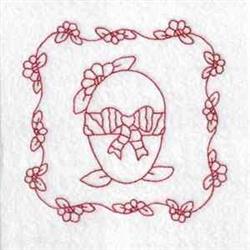 Redwork decorative egg with a bow and floral frame, celebrating Easter in a simple yet elegant style.