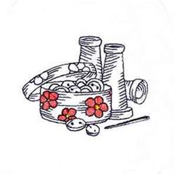 Redwork sewing thread spools beside a decorative sewing basket filled with buttons and bright red flowers.