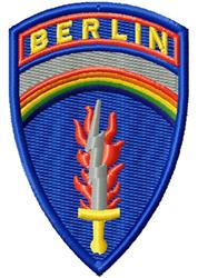 Shield-shaped patch featuring 'BERLIN' on a blue background with a gold sword, red flames, and a rainbow arch.