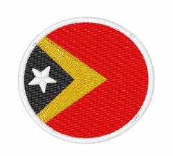 Circular patch with a vibrant red background, featuring a bold black triangle, yellow triangle, and white star.