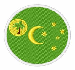 Circular patch featuring a playful yellow palm tree and crescent moon on a vivid green background, accented by white stars.