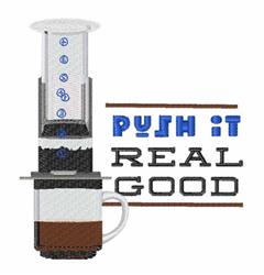 Playful coffee brewing device with a white coffee cup, featuring bold lettering 'PUSH IT REAL GOOD' in vibrant colors.