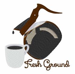 Vintage coffee grinder with wood handle and white cup of dark coffee, embroidered with 'Fresh Ground'.