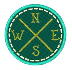 Applique compass design with dark green patch, gold cardinal directions, and turquoise border.
