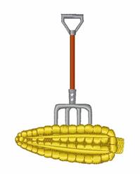 Vibrant corn cob with textured surface, paired with playful silver and orange garden fork, perfect for harvest themes.