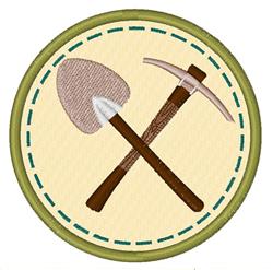 Cartoonish badge featuring crossed shovel and pickaxe over light beige, framed by a green stitched border.