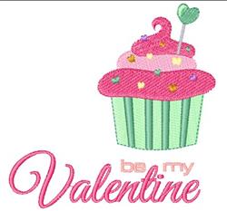 Cupcake with pink frosting and heart sprinkles in a green liner, perfect for Valentine's Day decor.