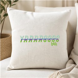 Decorative pillow with playful embroidered text, featuring neutral fabric and cozy textures for a modern look.
