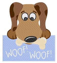Cute dog with floppy ears and a brown coat, playfully gazing with a bone on a light blue background.