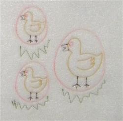 Whimsical duckling applique trio nestled in pastel eggs, accented with pink lines, set on playful grass - perfect for spring.
