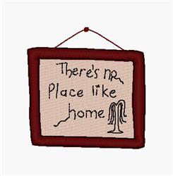 Framed sign with a red border, beige center, and handwritten text saying 'There's no place like home', hanging string.