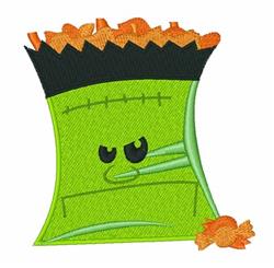 Frankenstein-themed candy bag in green with a black top, grumpy expression, and scattered orange candy, perfect for Halloween
