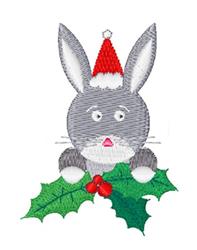 Cute gray rabbit in a red Santa hat, peeking from green holly with red berries, festive holiday embroidery.