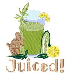 Colorful green juice in a tall glass, garnished with a lemon slice and leafy herbs, alongside ginger root.