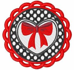 Applique heart shape with a vibrant red bow, outlined in black, and playful polka dots for Valentine's Day.
