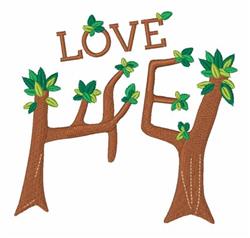 Applique word art 'LOVE' entwined with tree trunks and green leaves, perfect for spring weddings.