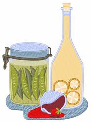 Colorful jar of pickles with green contents, yellow oil bottle, and red chili pepper on a gray mat.