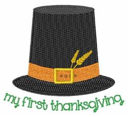 Pilgrim hat with a black body, orange belt, and wheat accents, featuring 'my first thanksgiving' in green, playful design.