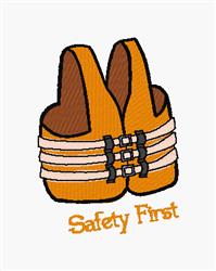 Playful life jacket in bright orange with brown straps and three buckles, featuring 'Safety First' in cheerful font.