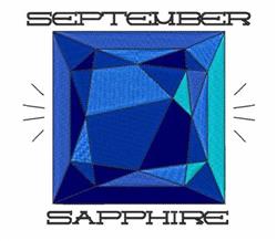 Stylized sapphire gemstone in shades of blue and green, featuring a glossy geometric shape and text 'SEPTEMBER' and 'SAPPHIRE