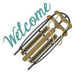 Sled with earthy tones and vibrant teal 'Welcome' text, playful winter decor for home accents.