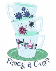 Playful stacked coffee cups with vibrant floral patterns on a green plate, 'Fancy a Cup?' text below.