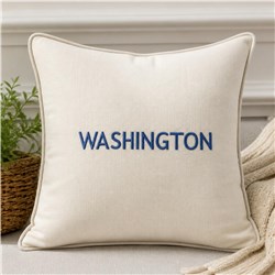 Cream pillow with bold blue 'WASHINGTON' text, modern design, cozy style, perfect for decor.