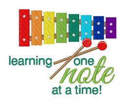 Colorful xylophone with vibrant bars and red mallets, featuring playful green text for educational fun.