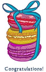 Applique stack of colorful macarons in yellow, purple, and pink tied with a blue ribbon, celebrating with 'Congratulations!'