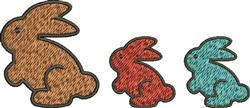 Playful trio of stylized bunnies in brown, red, and teal with textured outlines, perfect for Easter decorations.