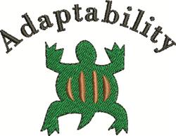 Whimsical green turtle with distinct outlines and striped shell, curved 'Adaptability' text in dark thread.