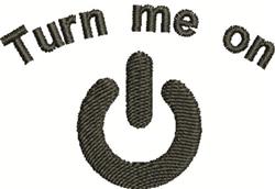 Modern power button icon with a playful 'Turn me on' text, stitched in dark thread on a light background.