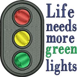 Colorful traffic light with red, yellow, green lights and 'Life needs more green lights' phrase in playful font.