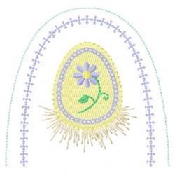 Decorative Easter egg with a pastel yellow hue, adorned with a purple flower and green stem, surrounded by grass.